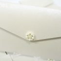 ivory pocketfold A6 invite with large pearl cluster